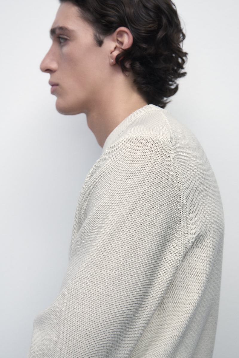 Reverse knitted sweater