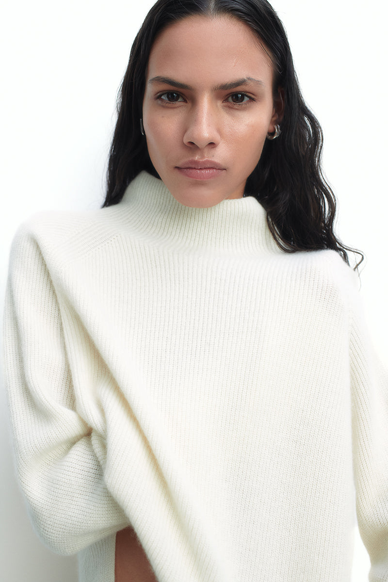 Cashmere sweater with a turtleneck and side slits